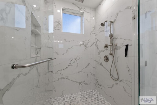 bathroom featuring an enclosed shower