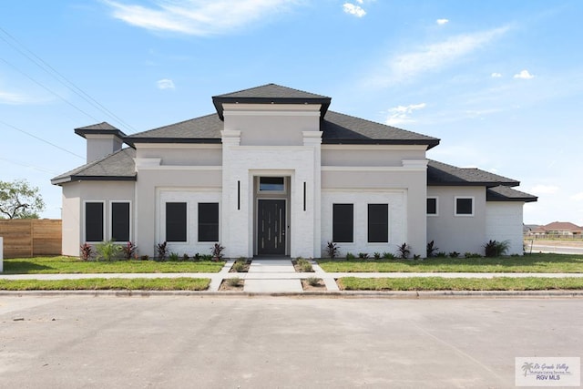 prairie-style home with a front yard