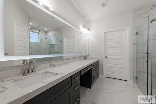 bathroom featuring an enclosed shower and vanity