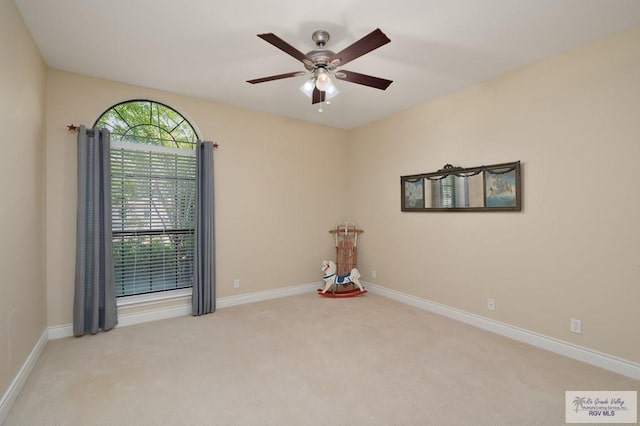 1808 E Palm Valley Dr, Harlingen, TX 78552 - empty room with carpet flooring, a ceiling fan, and baseboards