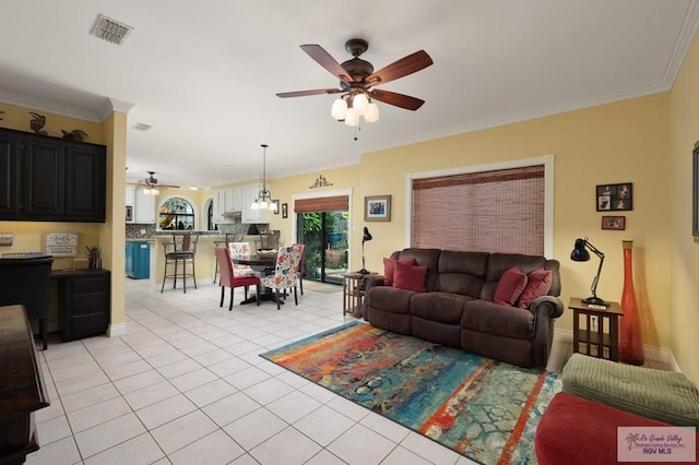 1808 E Palm Valley Dr, Harlingen, TX 78552 - living area with ceiling fan, light tile patterned floors, and ornamental molding