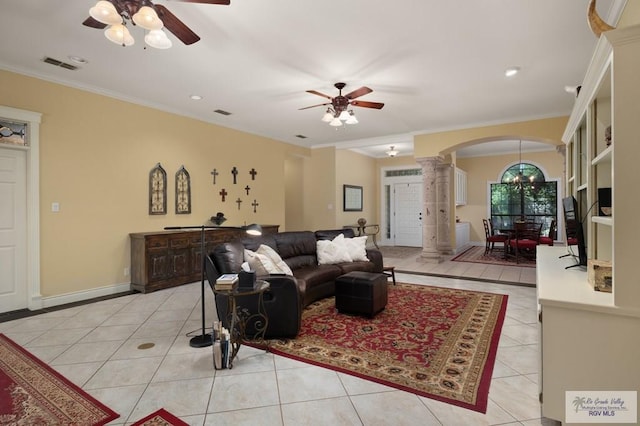 1808 E Palm Valley Dr, Harlingen, TX 78552 - living area with decorative columns, arched walkways, a ceiling fan, light tile patterned flooring, and ornamental molding
