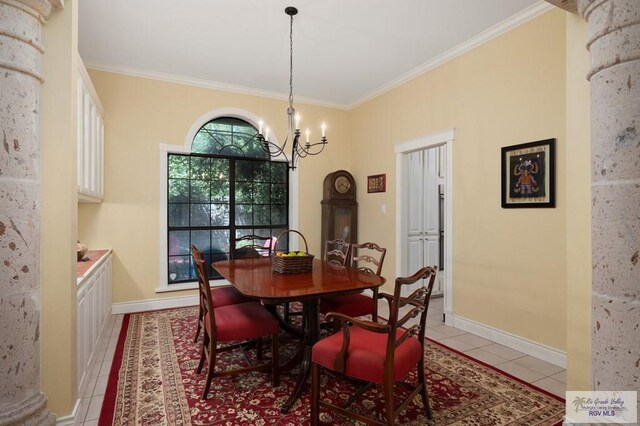 1808 E Palm Valley Dr, Harlingen, TX 78552 - dining area featuring light tile patterned floors, crown molding, a chandelier, and baseboards