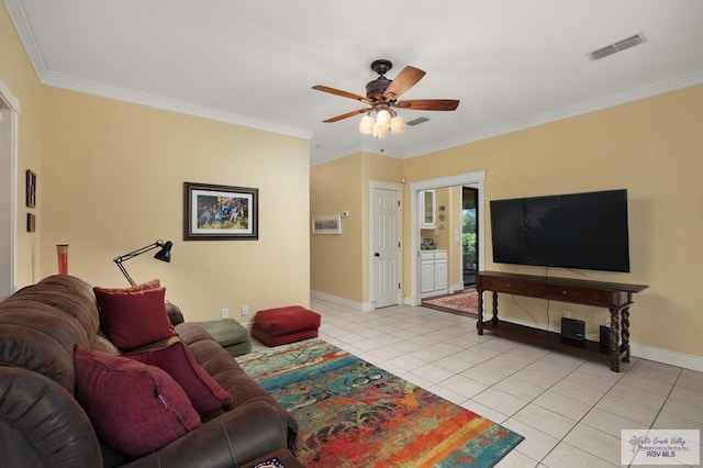1808 E Palm Valley Dr, Harlingen, TX 78552 - living room featuring ceiling fan, light tile patterned flooring, baseboards, and crown molding