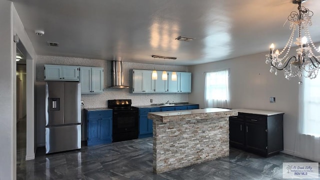 kitchen featuring wall chimney range hood, visible vents, electric range, blue cabinetry, and stainless steel refrigerator with ice dispenser