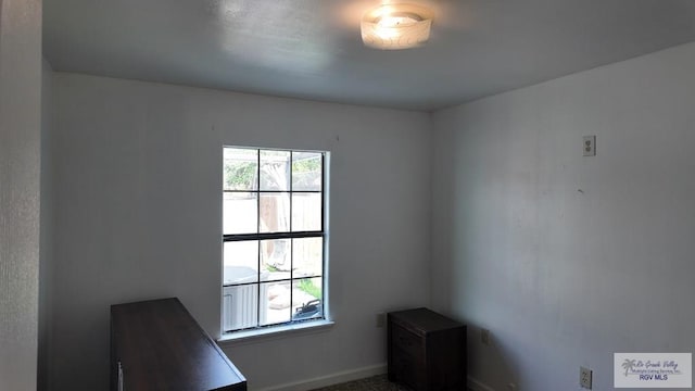 interior space featuring baseboards