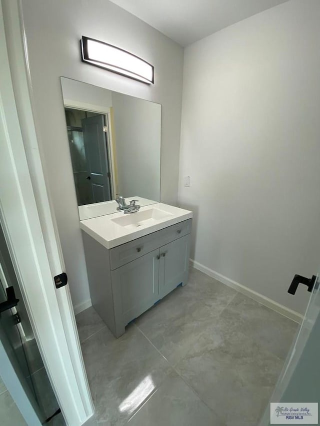 bathroom featuring vanity and concrete flooring