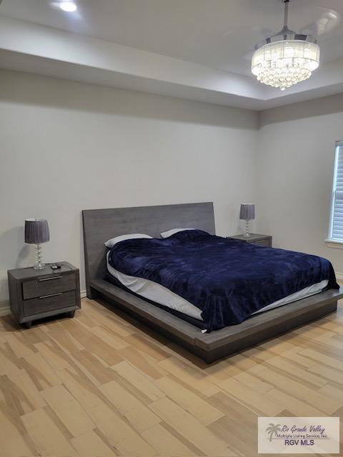 bedroom with light wood-type flooring