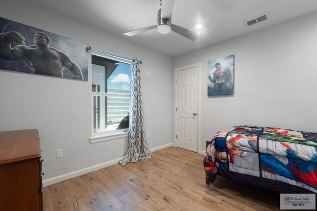 500 Parker Cir # 21, La Feria, TX 78559 - bedroom with wood finished floors, baseboards, and a ceiling fan