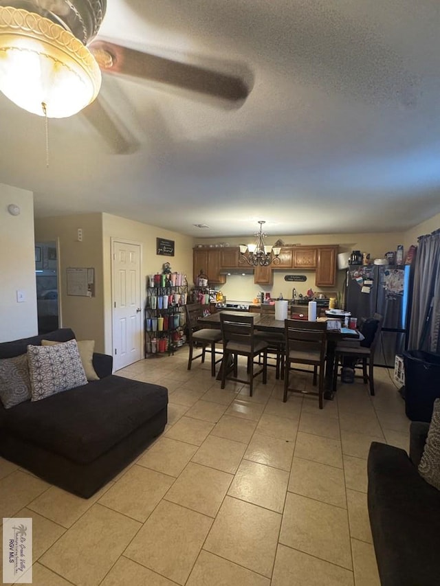 2965 Monte Cristo Dr, Brownsville, TX 78526 - dining room featuring light tile patterned floors and a chandelier