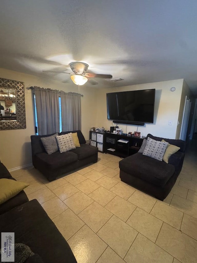2965 Monte Cristo Dr, Brownsville, TX 78526 - living room with light tile patterned floors and a ceiling fan
