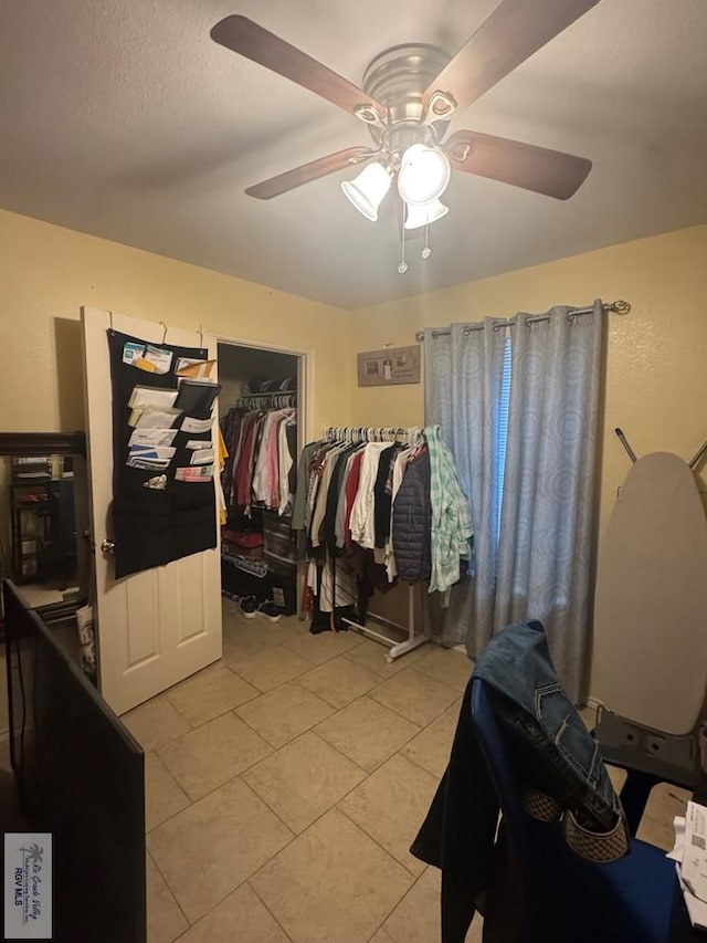 2965 Monte Cristo Dr, Brownsville, TX 78526 - walk in closet with a ceiling fan and light tile patterned flooring
