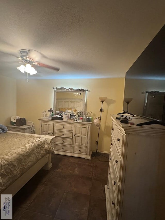 2965 Monte Cristo Dr, Brownsville, TX 78526 - bedroom with ceiling fan and dark tile patterned floors