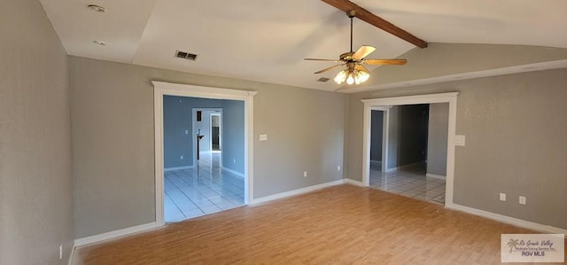 unfurnished room featuring vaulted ceiling with beams, light hardwood / wood-style flooring, and ceiling fan