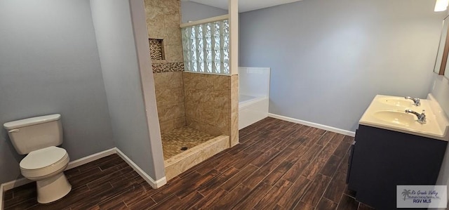 full bathroom with toilet, vanity, independent shower and bath, and hardwood / wood-style flooring