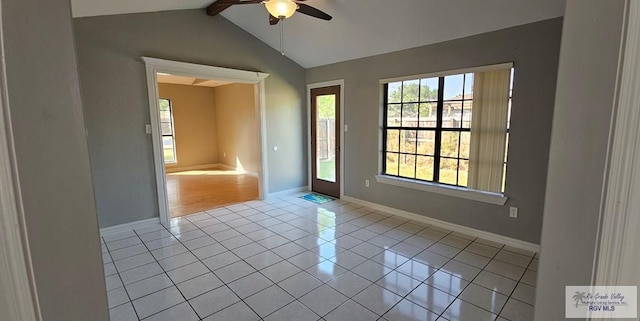 tiled empty room featuring ceiling fan and lofted ceiling with beams