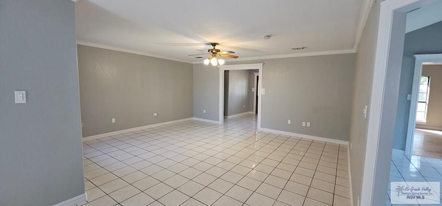 spare room featuring light tile patterned floors, ceiling fan, and crown molding