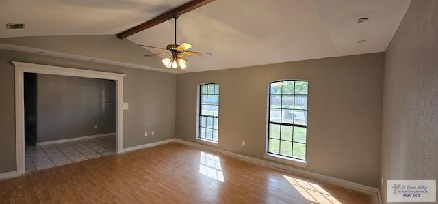 empty room featuring vaulted ceiling with beams, light wood-type flooring, and ceiling fan