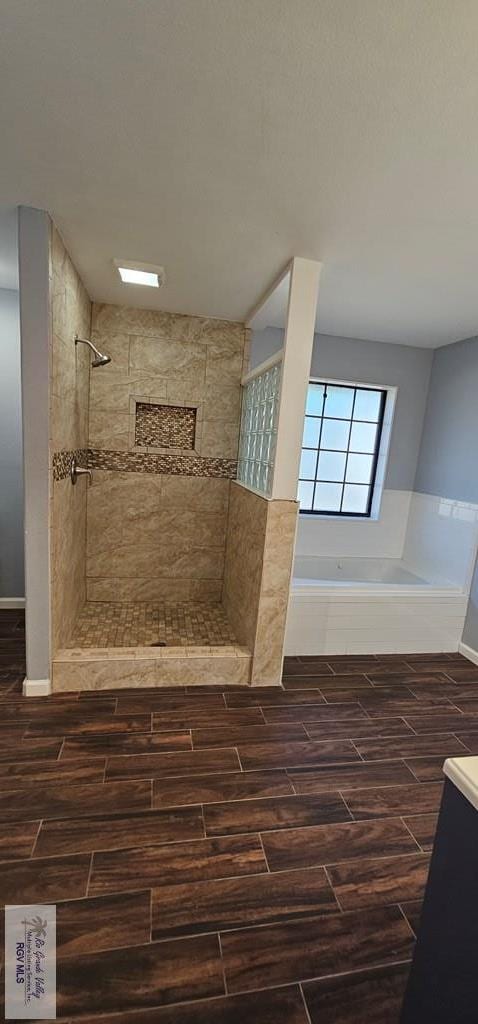 bathroom with vanity and tiled shower