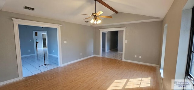 spare room with vaulted ceiling with beams, ceiling fan, and light hardwood / wood-style flooring