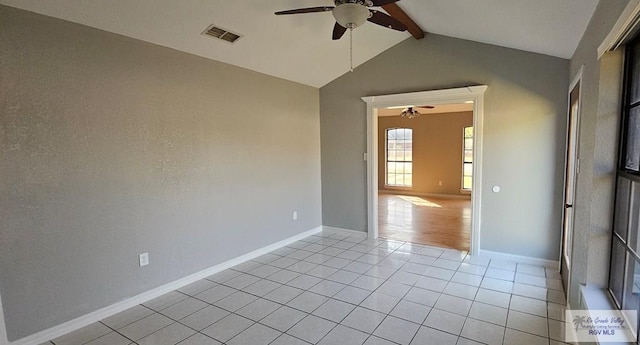 tiled empty room featuring vaulted ceiling with beams and ceiling fan