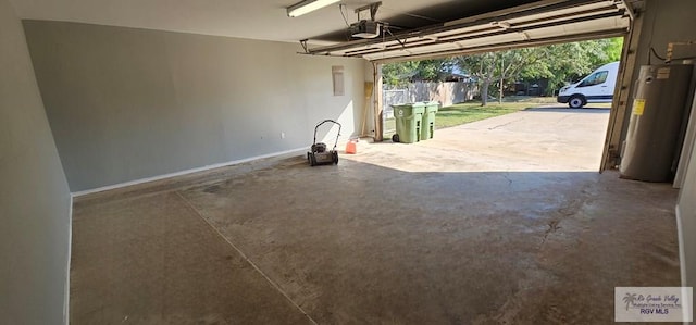 garage featuring gas water heater and a garage door opener