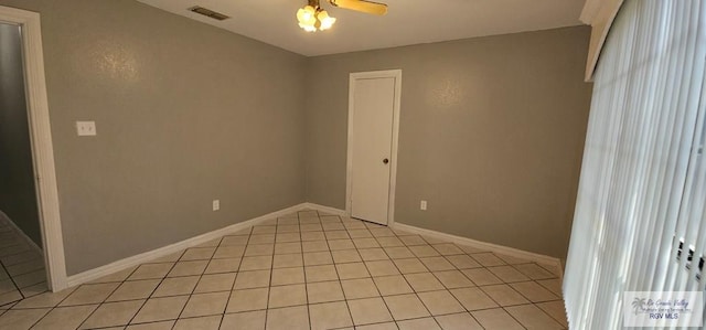 unfurnished room featuring ceiling fan and light tile patterned floors