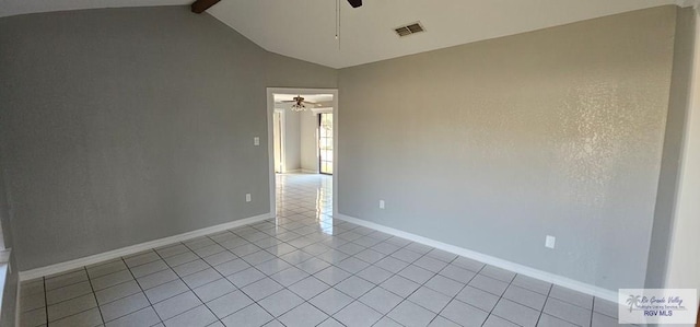 empty room featuring light tile patterned floors, lofted ceiling with beams, and ceiling fan