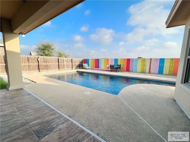 view of pool featuring a patio