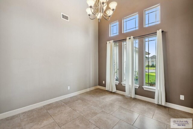 1510 Karis Ct, Harlingen, TX 78550 - entryway with a chandelier, healthy amount of natural light, light tile patterned flooring, and a high ceiling
