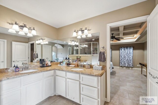 1510 Karis Ct, Harlingen, TX 78550 - full bath featuring double vanity, a stall shower, ceiling fan, and coffered ceiling