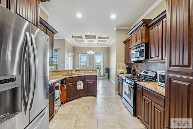 1510 Karis Ct, Harlingen, TX 78550 - kitchen with appliances with stainless steel finishes, ornamental molding, backsplash, a chandelier, and coffered ceiling