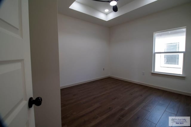 1272 Bridle Way, San Benito, TX 78586 - spare room with dark wood finished floors, a raised ceiling, recessed lighting, and ceiling fan