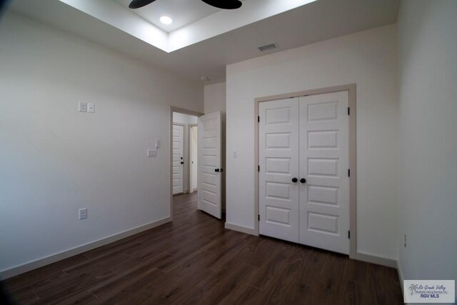 1272 Bridle Way, San Benito, TX 78586 - unfurnished bedroom featuring dark wood-style floors, a closet, and a ceiling fan