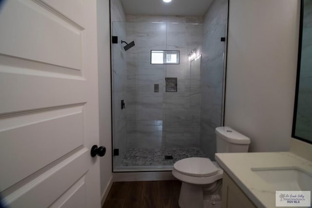 1272 Bridle Way, San Benito, TX 78586 - bathroom with vanity, a shower stall, and wood finished floors