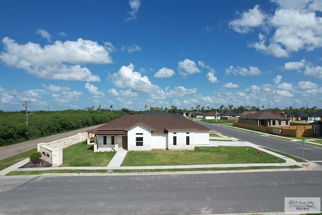 1272 Bridle Way, San Benito, TX 78586 - view of front facade featuring a front lawn and a residential view