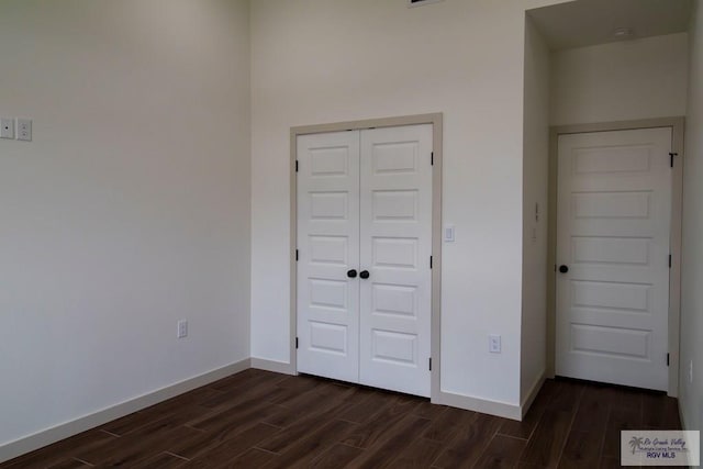 1272 Bridle Way, San Benito, TX 78586 - unfurnished bedroom with dark wood-type flooring and a closet