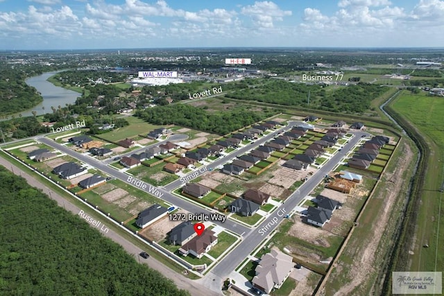 1272 Bridle Way, San Benito, TX 78586 - aerial view of property's location with a large body of water and nearby suburban area