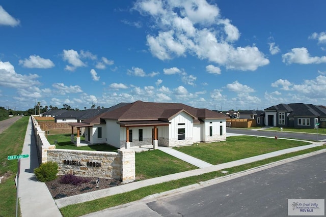 1272 Bridle Way, San Benito, TX 78586 - view of front of house featuring board and batten siding, stone siding, and a residential view