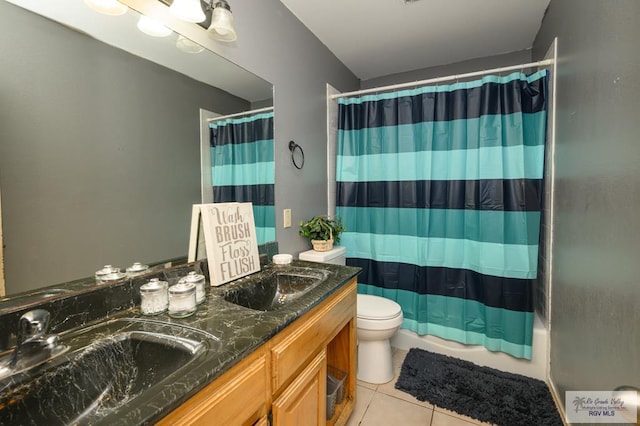 full bathroom with tile patterned flooring, vanity, toilet, and shower / bathtub combination with curtain