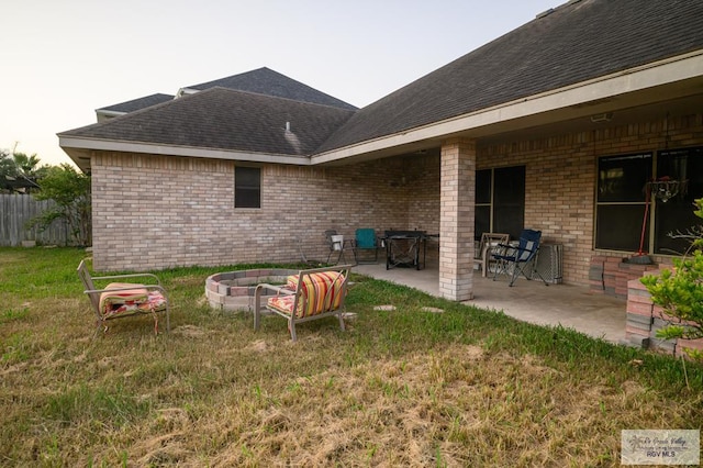 view of yard with a patio area and an outdoor fire pit