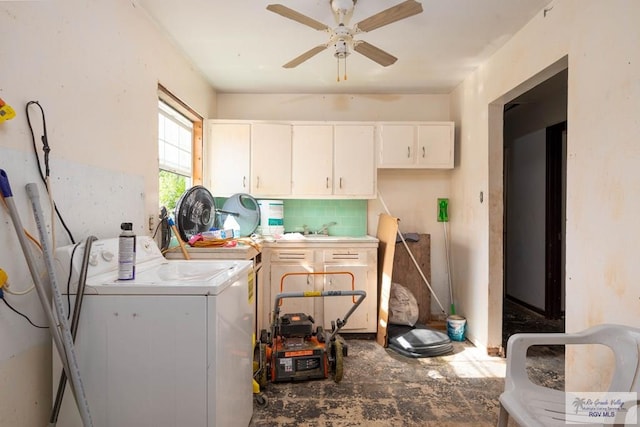 clothes washing area featuring ceiling fan, washer and clothes dryer, and cabinets