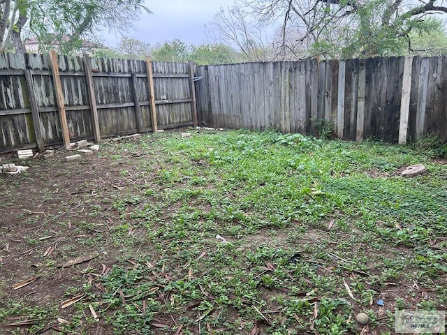 view of yard with a fenced backyard
