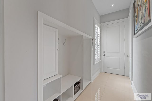 mudroom with light tile patterned flooring