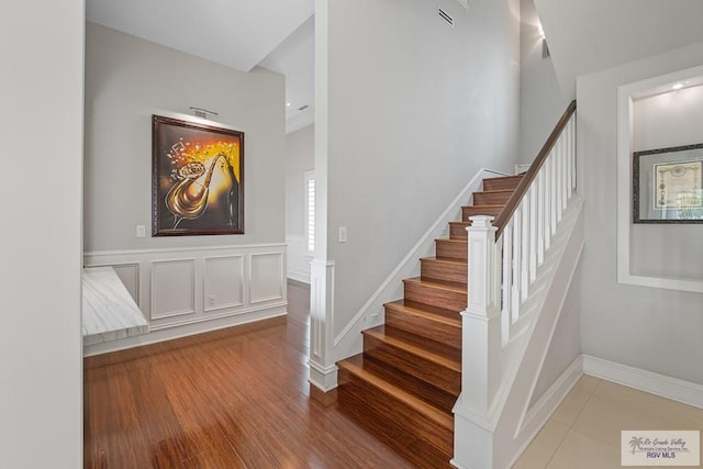 stairway featuring hardwood / wood-style flooring