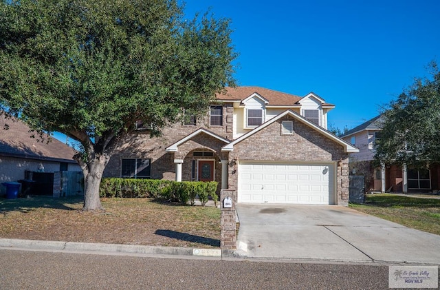 view of front of house featuring a garage and a front yard