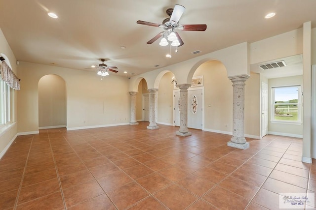 12612 E Clark Rd, La Feria, TX 78559 - unfurnished living room with decorative columns, recessed lighting, ceiling fan, tile patterned floors, and arched walkways
