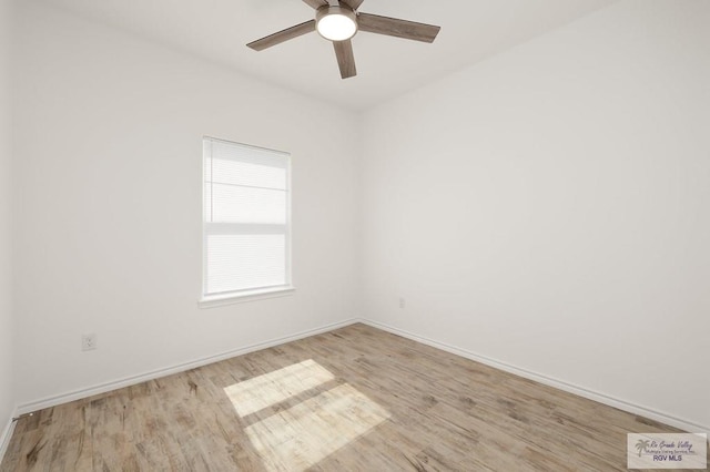 empty room with ceiling fan and light wood-type flooring