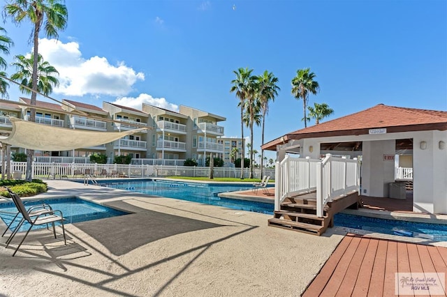 view of swimming pool featuring a patio area