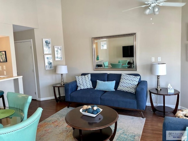 200 S Padre Blvd Unit 1303, South Padre Island, TX 78597 - living area with wood finished floors, baseboards, a ceiling fan, and a towering ceiling
